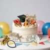 21 pieces graduation cake topper set decorated on white graduation party cake with gold floral and grad cap decor