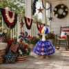 Patriotic USA themed goose costume set decorating front porch railings for Independence Day holiday display