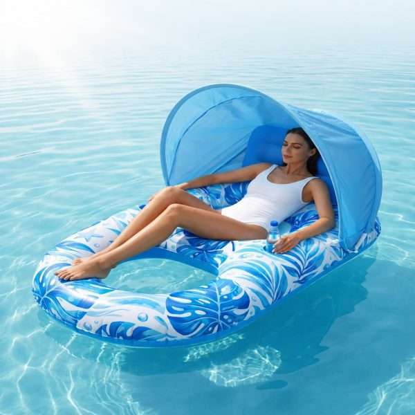 Adult Pool Float with Canopy tropical leaf print inflatable shade lounger floating on clear pool water