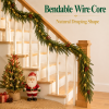 Bendable wire core Norfolk pine garland on staircase banister with natural draping shape