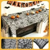 Black spider web fireplace mantel scarf with pumpkins and bats for Halloween home decor
