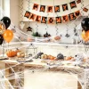 Halloween indoor decorations on kitchen party table with spider web balloons and Happy Halloween banner