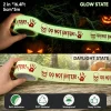 Glow state versus daylight state of the 2 in x 16.4 ft Halloween caution tape, with self-adhesive and waterproof icons
