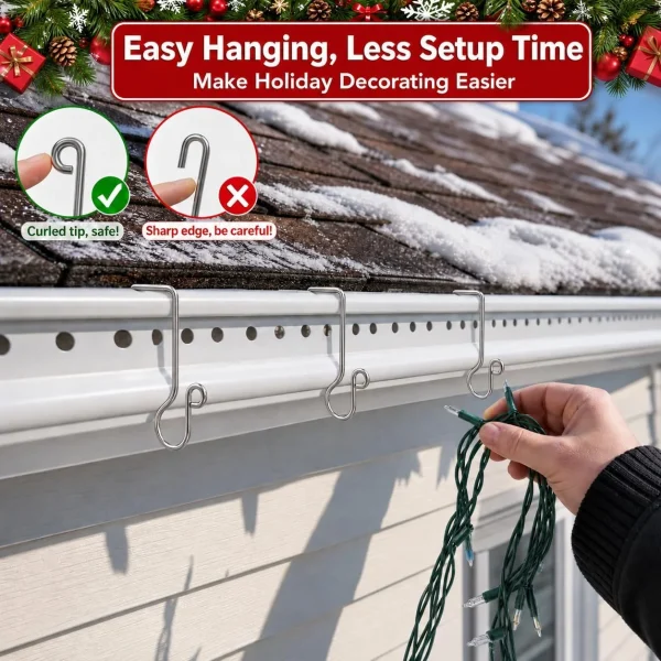 Hand hanging Christmas light wire onto stainless steel gutter clips along a snowy roofline; curled tip is safe versus sharp edge