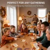Family and kids laughing while playing the Thanksgiving turkey hunt game at the dinner table
